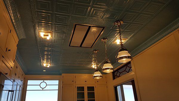 A kitchen with lights hanging from it