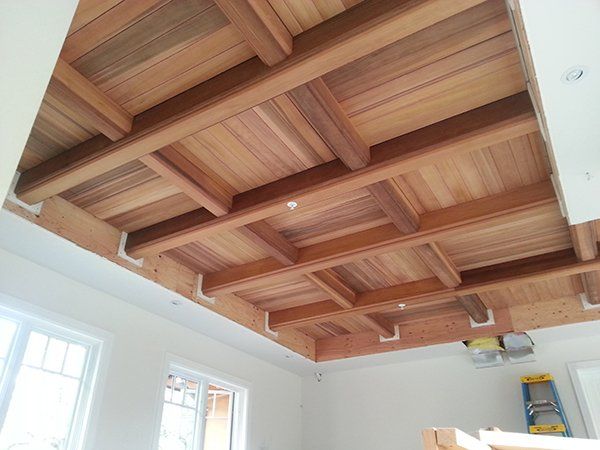 A room with a wooden ceiling 