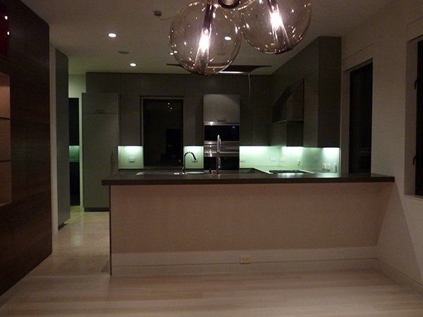 A kitchen with stainless steel appliances and a large island