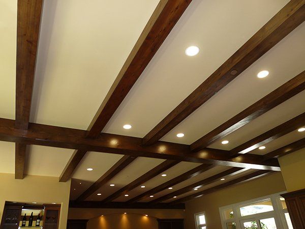 A ceiling with wooden beams