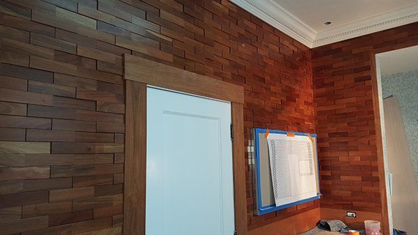 A bathroom with a wooden wall