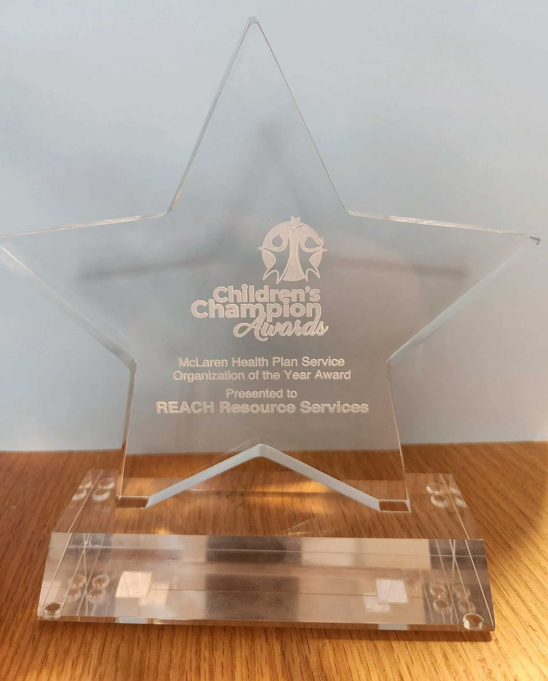 Star-shaped award with engraved text for 