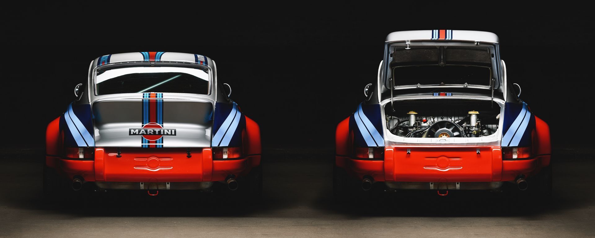 Two Porsche 911s with Martini livery, one with the engine cover open. Red, blue, and white racing stripes.