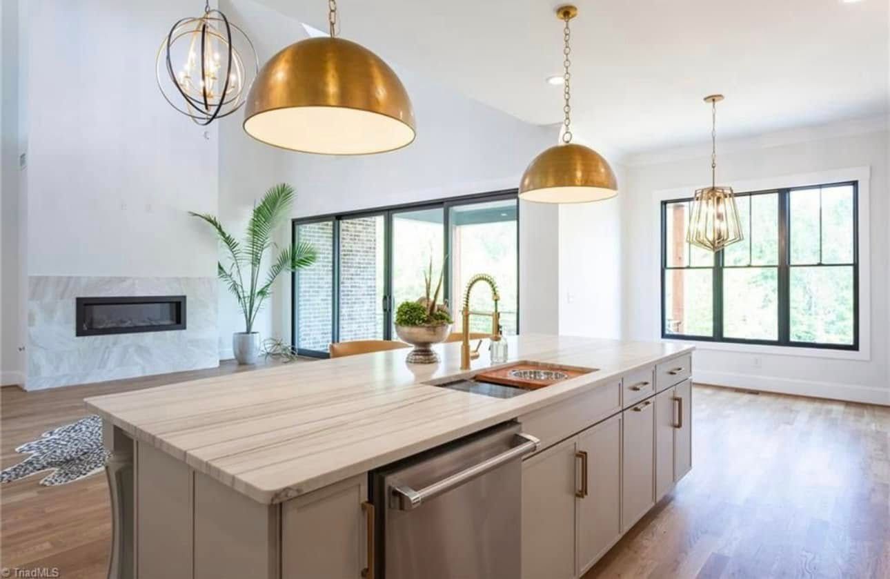 There is a large island in the middle of the kitchen.
