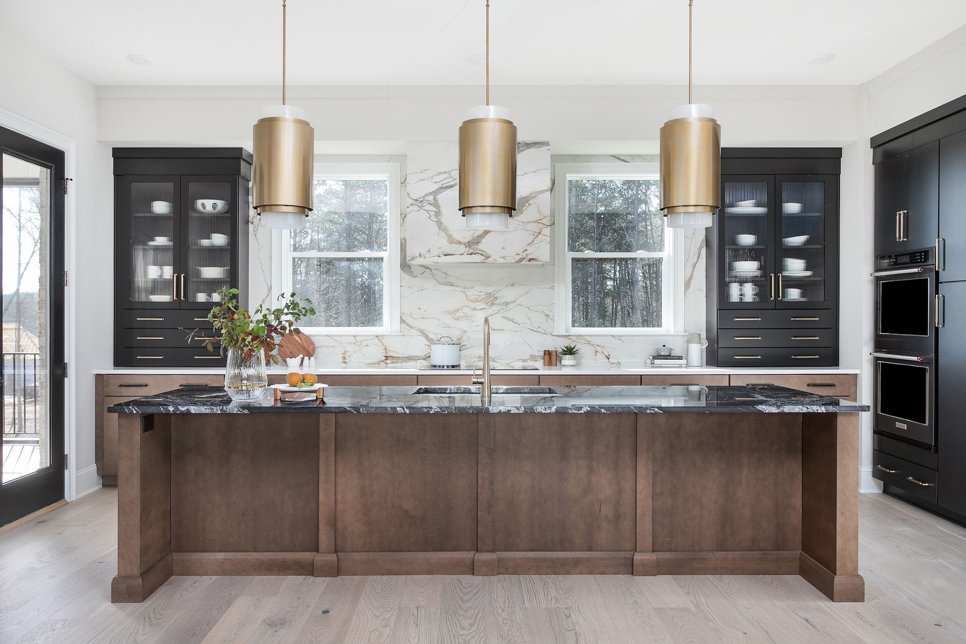 A kitchen with a large island in the middle of the room.