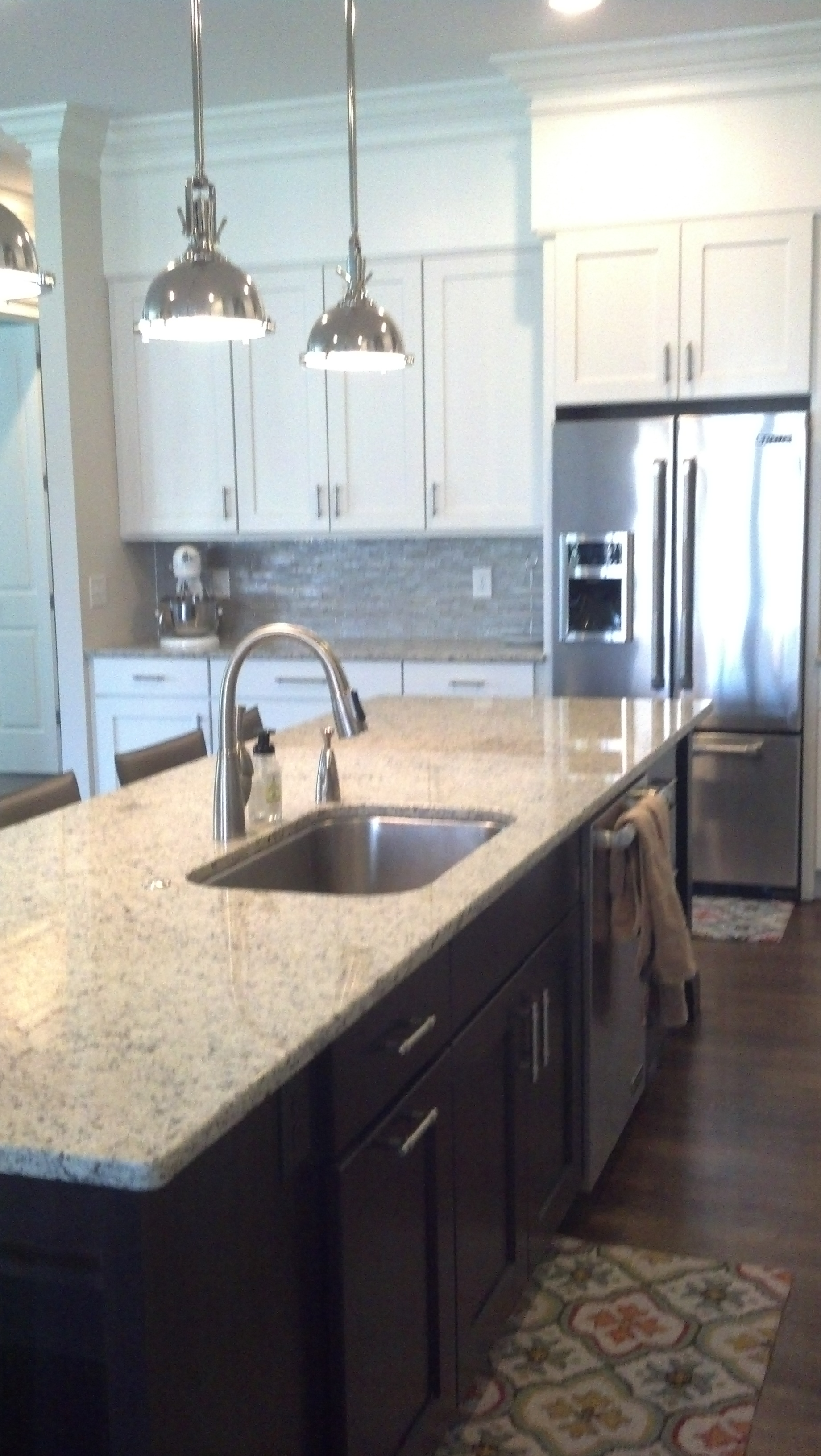 A kitchen with stainless steel appliances and granite counter tops