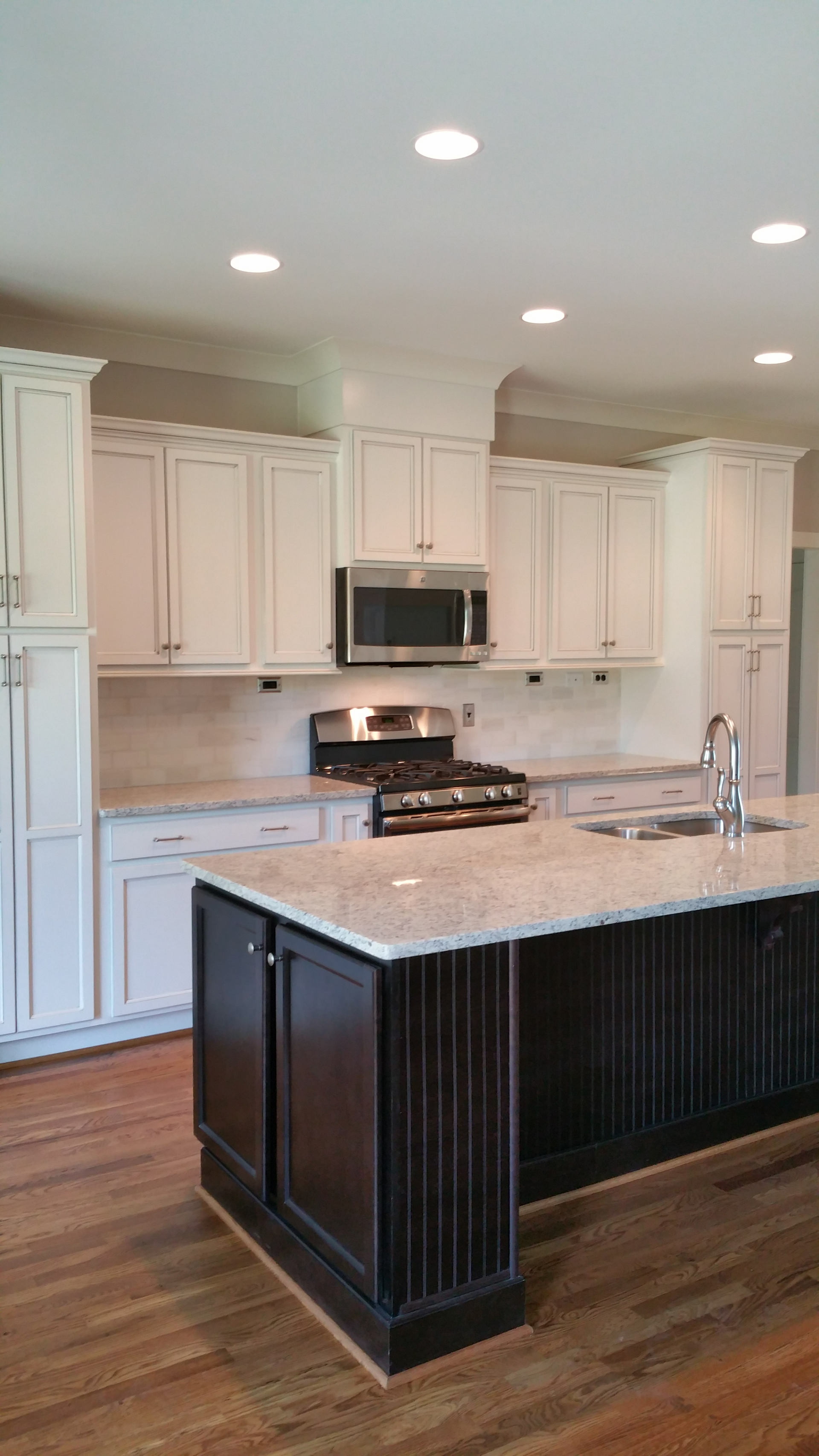 There is a large island in the middle of the kitchen.