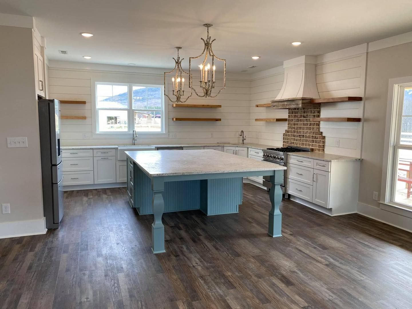 There is a large island in the middle of the kitchen.