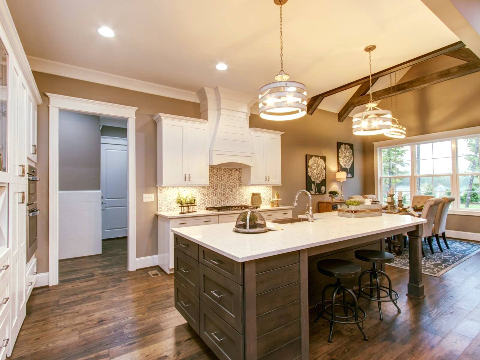 A kitchen with a large island in the middle of the room.