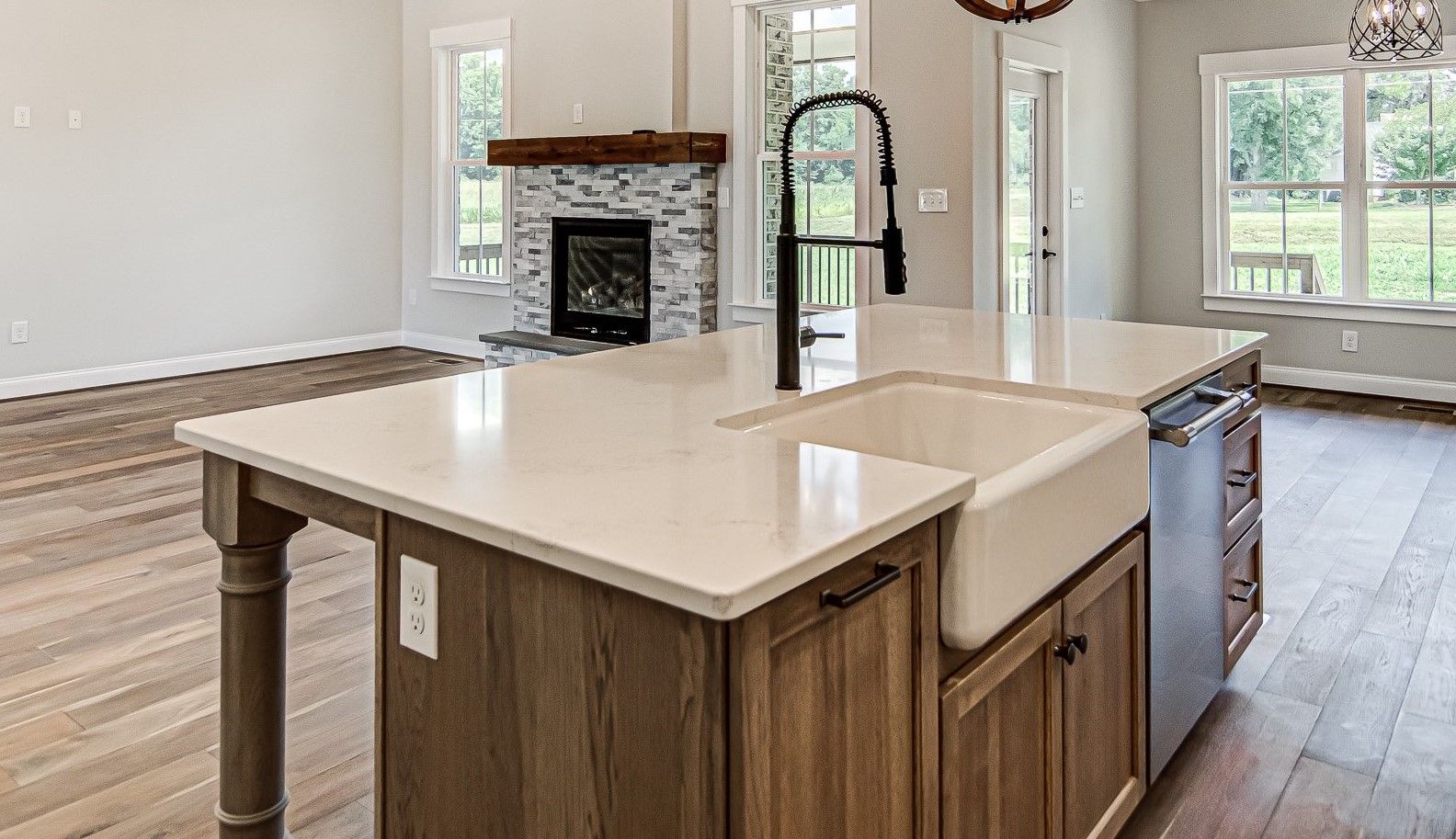 A kitchen with a large island and a sink.