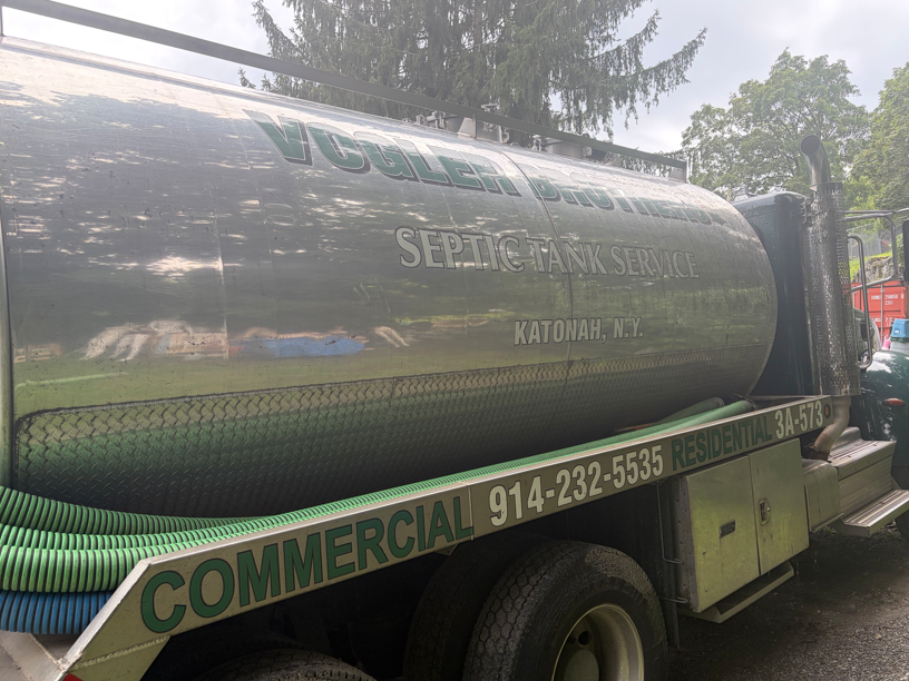 Green vacuum tanker truck with 