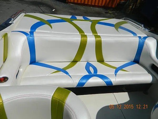 Boat seat with green and blue lines design