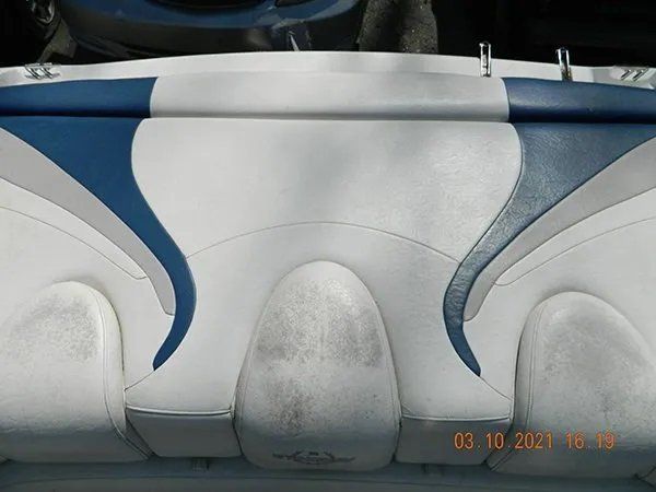 White with blue gray design boat cushion before