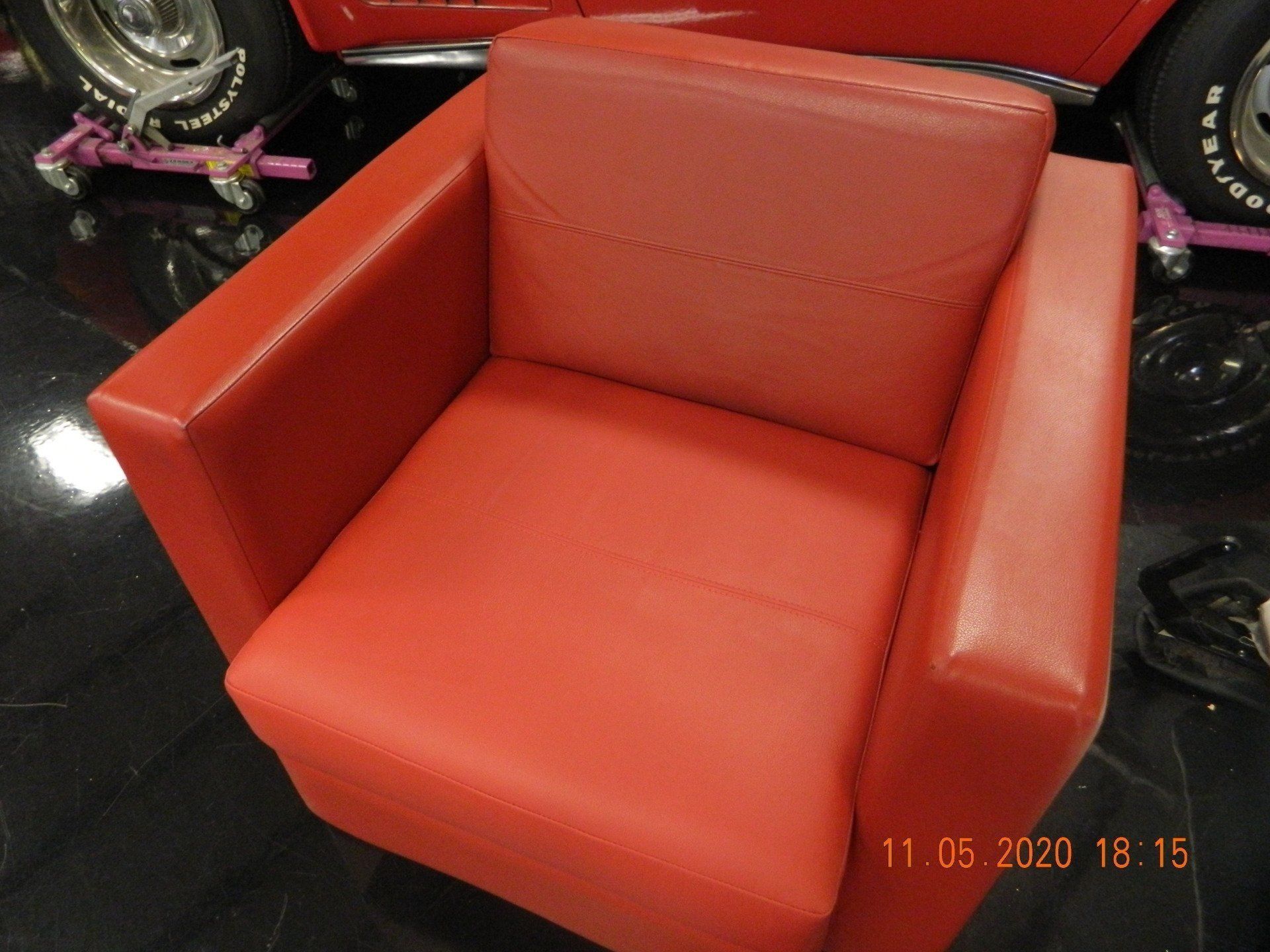 Custom red colored single sofa