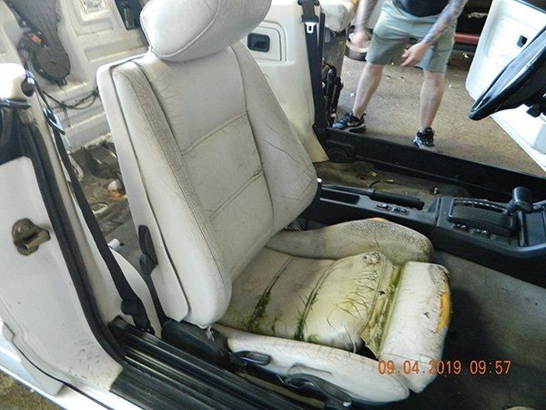 Damaged light gray passenger seat