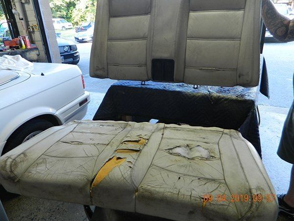 Damaged light gray back seat
