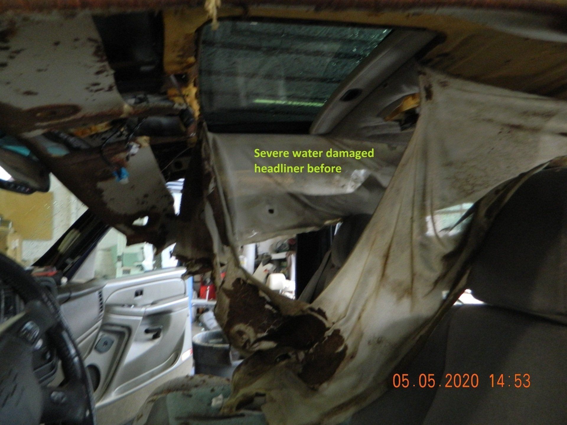 Severe water damaged headliner before
