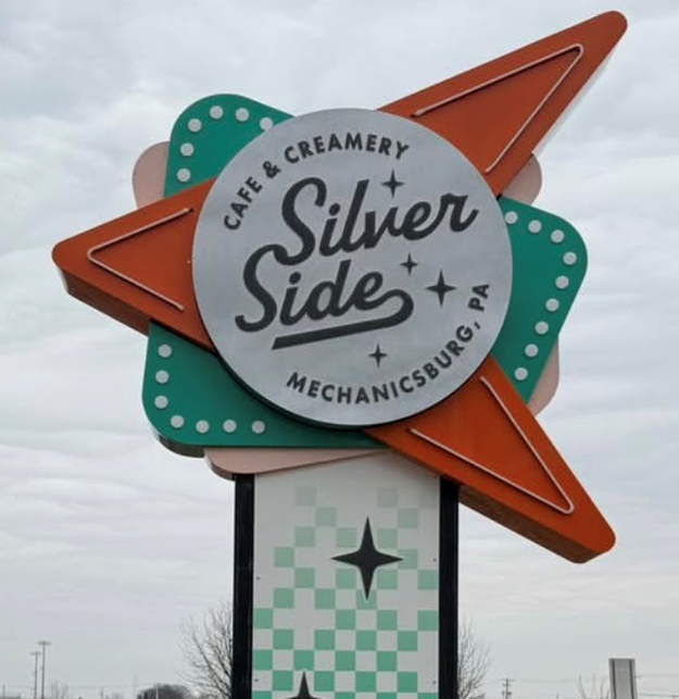 Sign for Silver Side Cafe and Creamery in Mechanicsburg, PA, with a retro starburst design.