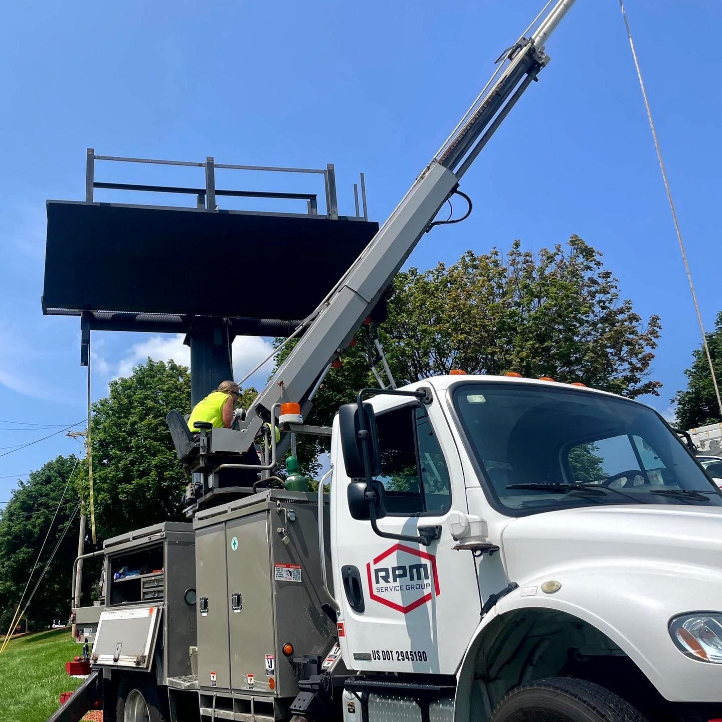 A white truck with the word rpm on the side
