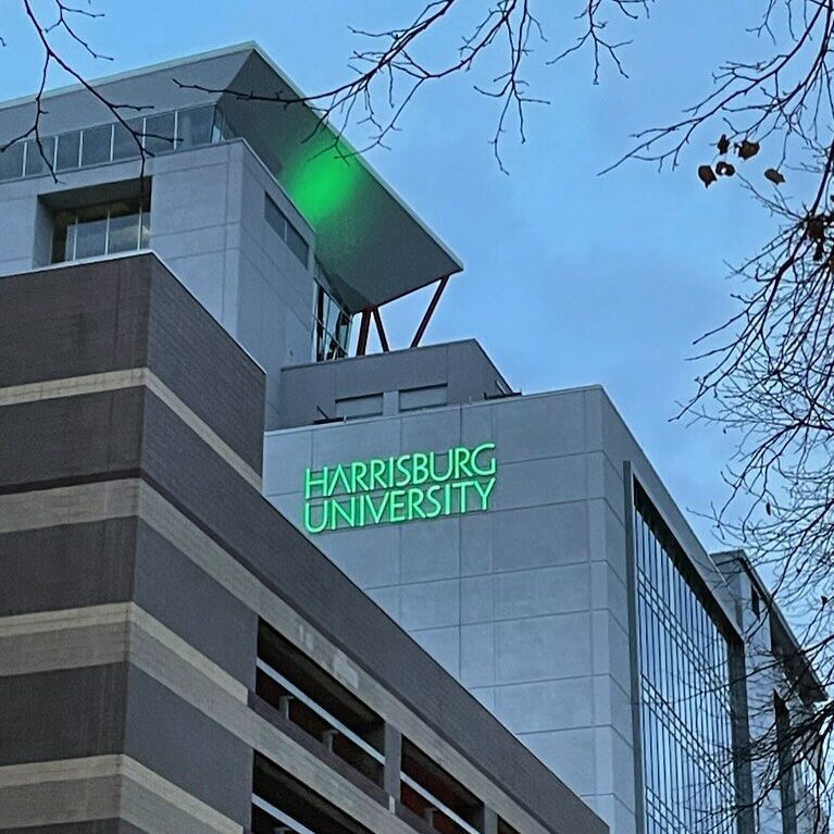 A large building with the words harrisburg university on it