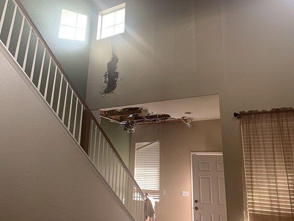 stairs with damaged ceiling
