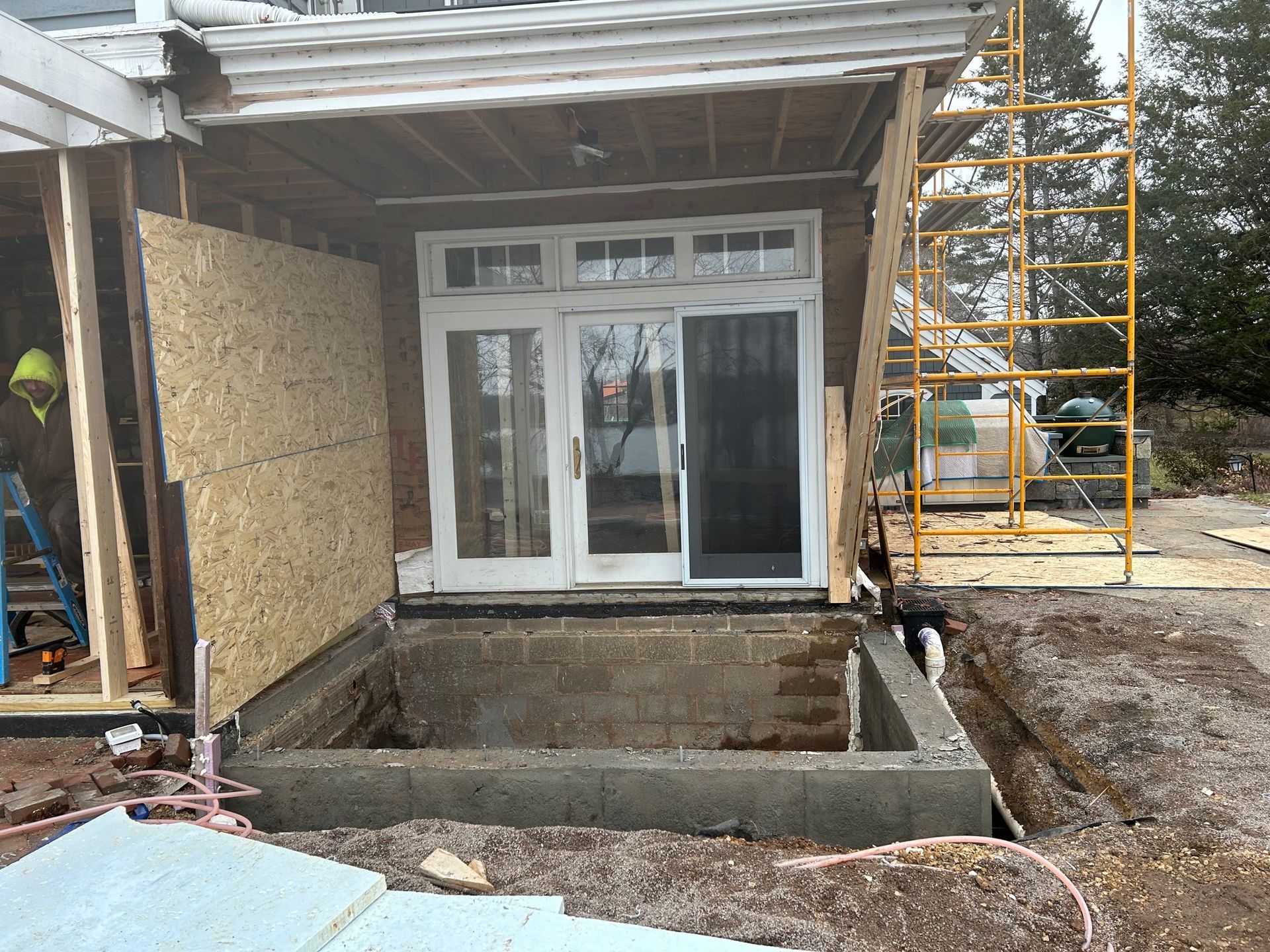 A house is being remodeled with a sliding glass door.