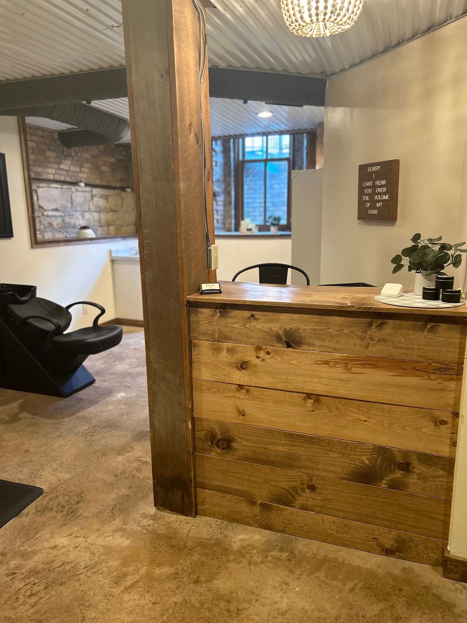 There is a wooden counter in the middle of the room.