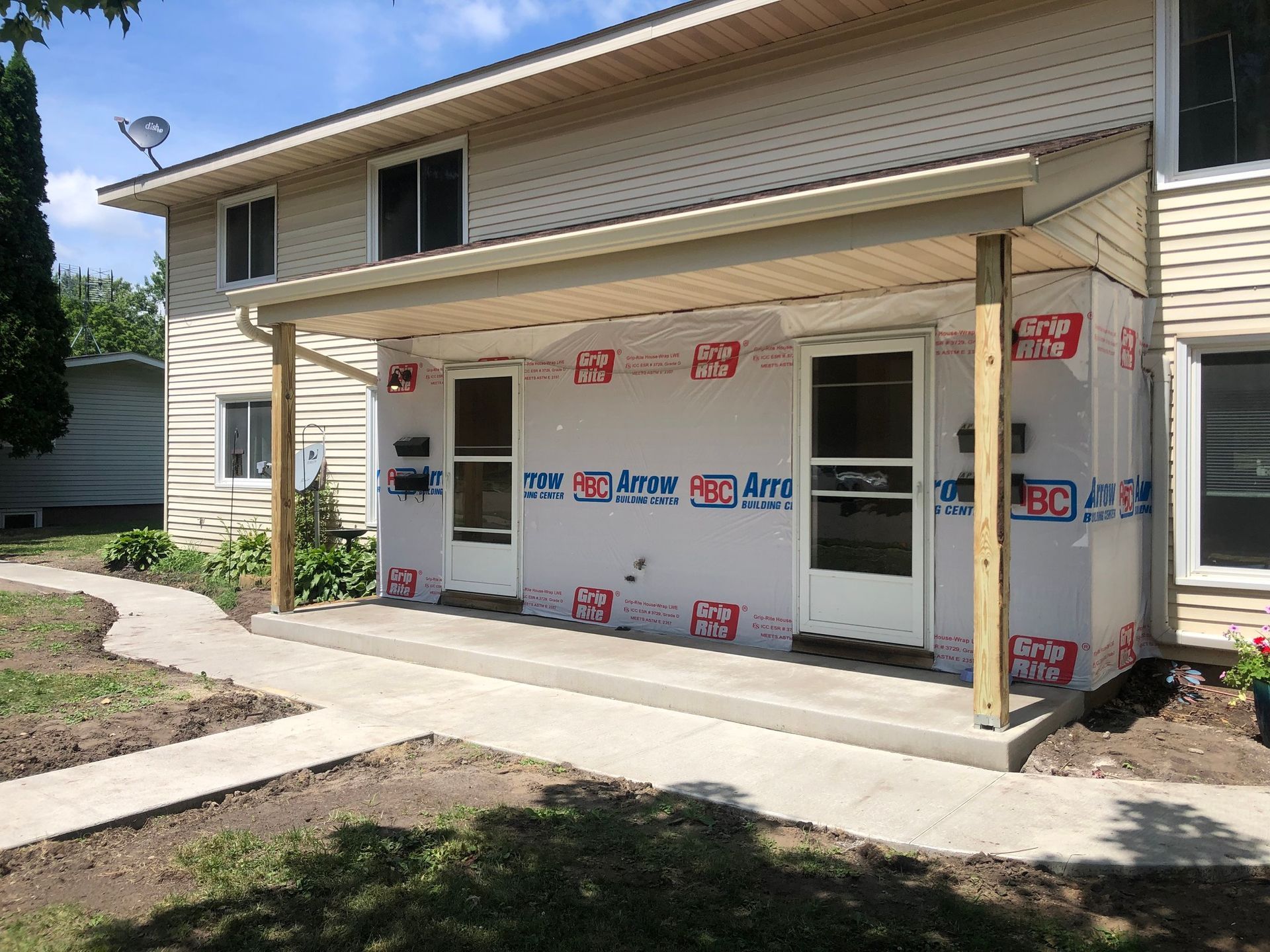 A house with a porch is being remodeled.
