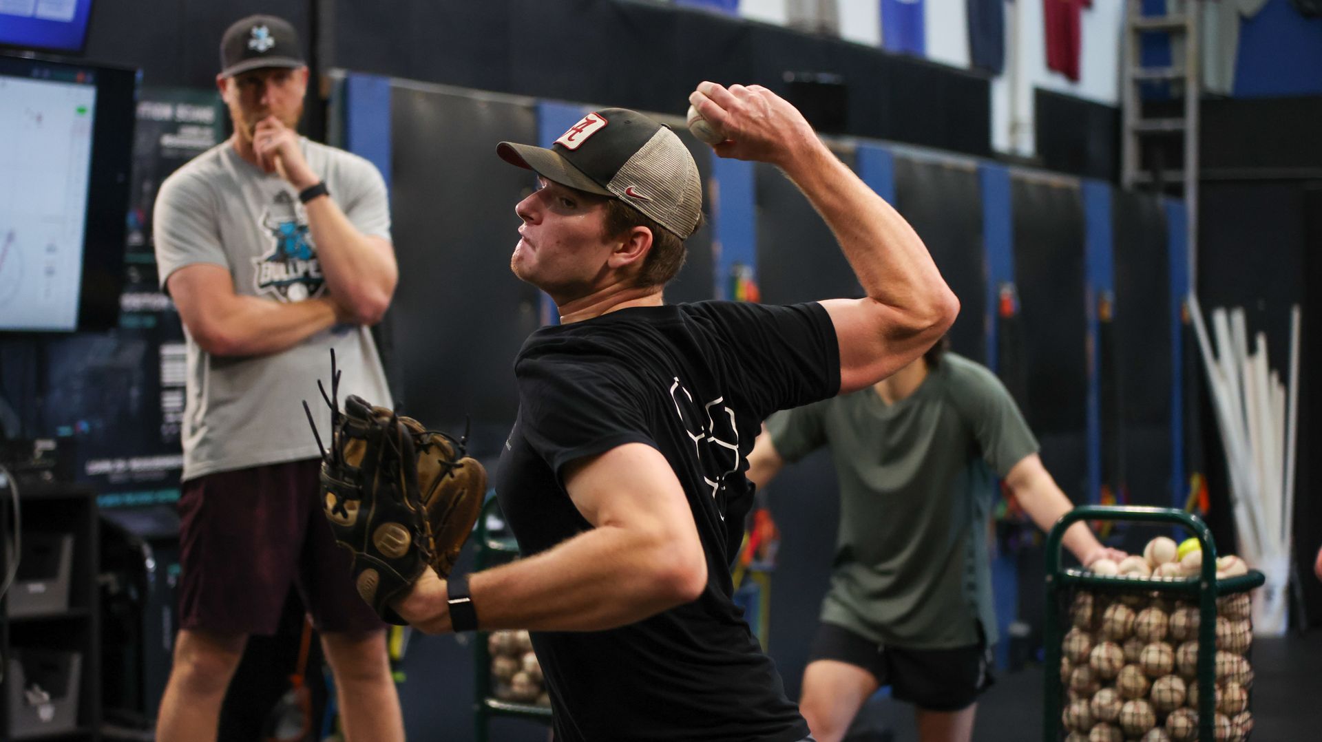 A baseball player is swinging a bat at a ball.