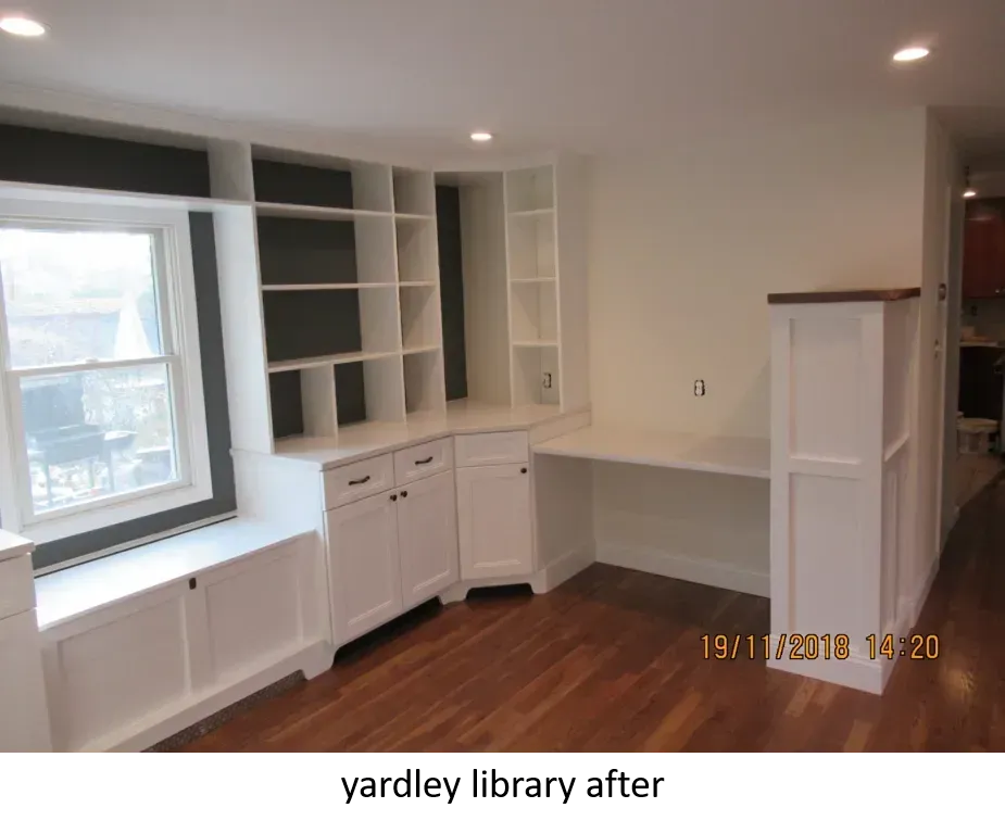 White built-in bookshelves and desk in a room with hardwood floors and a window, labeled 