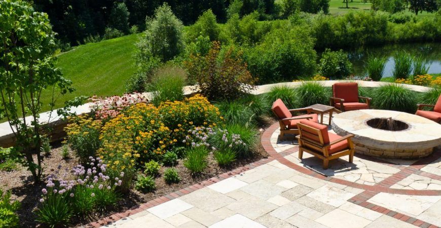 There is a fire pit in the middle of the patio.