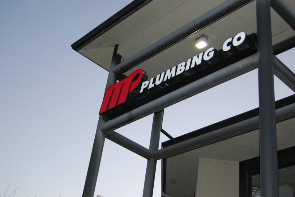MP Plumbing Co sign