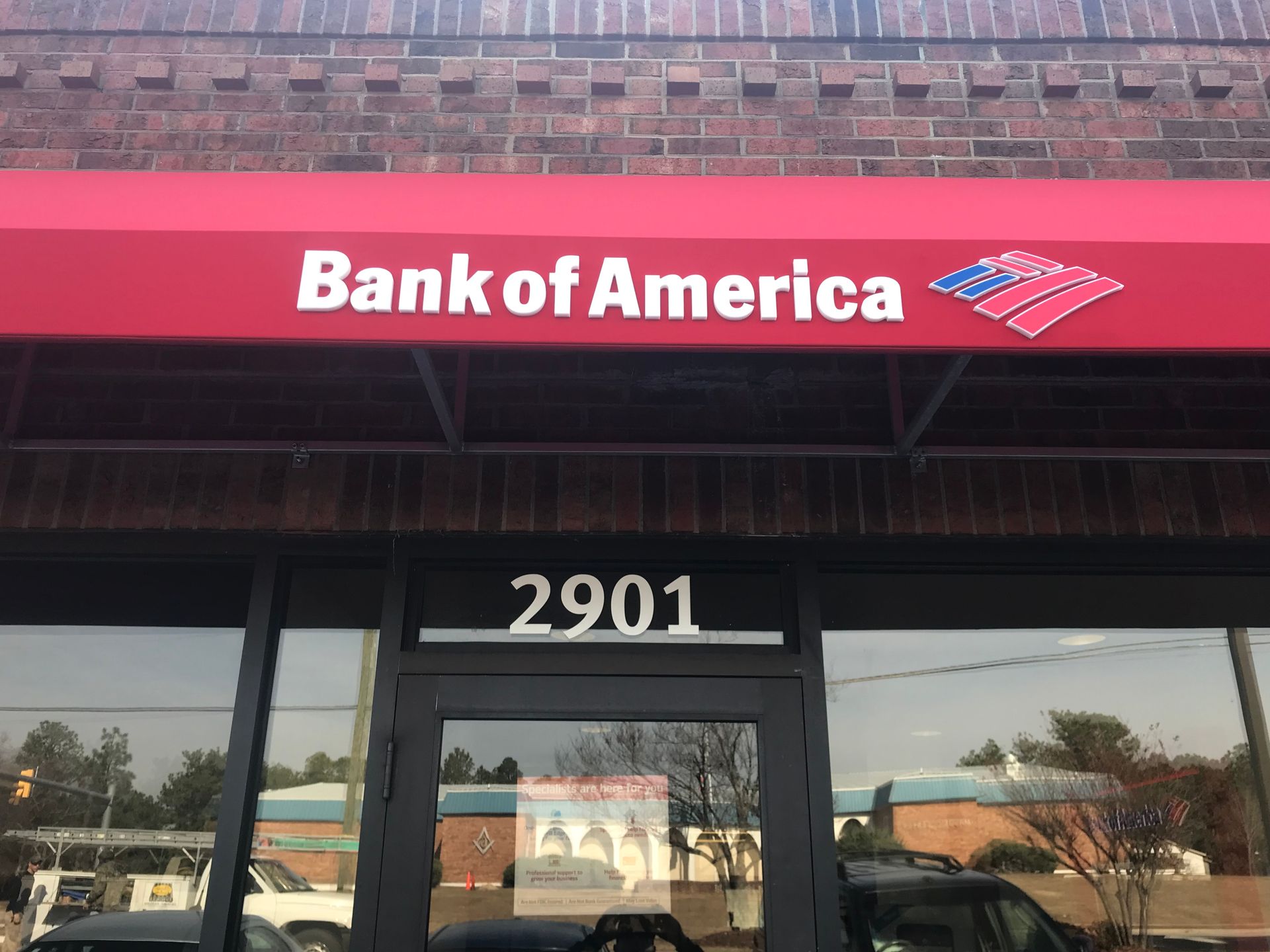 Bank of America storefront with red sign and address 2901 above the entrance