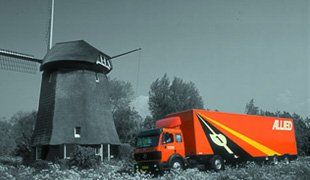Truck beside a windmill