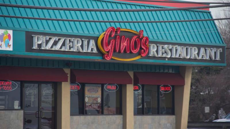 The front of a pizzeria called gino 's restaurant