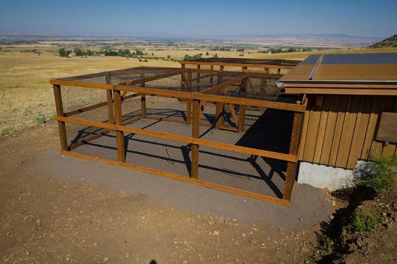 An aerial view of a wooden fence around a house.