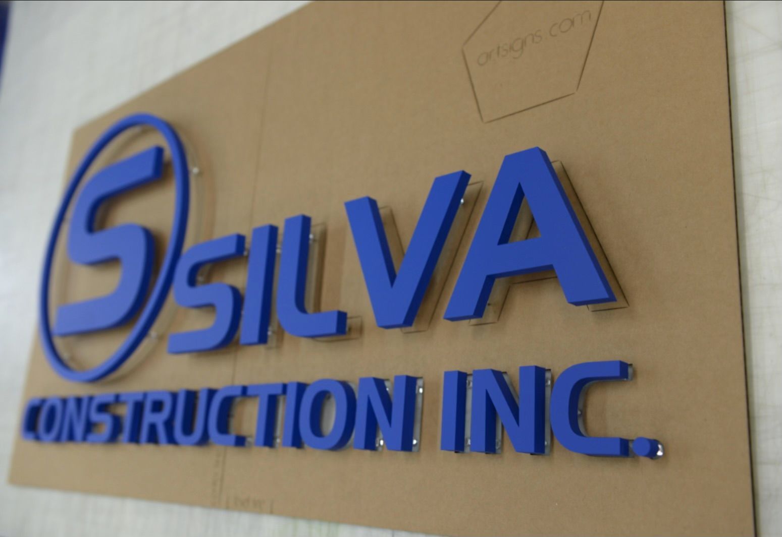 A cardboard sign that says silva construction inc.