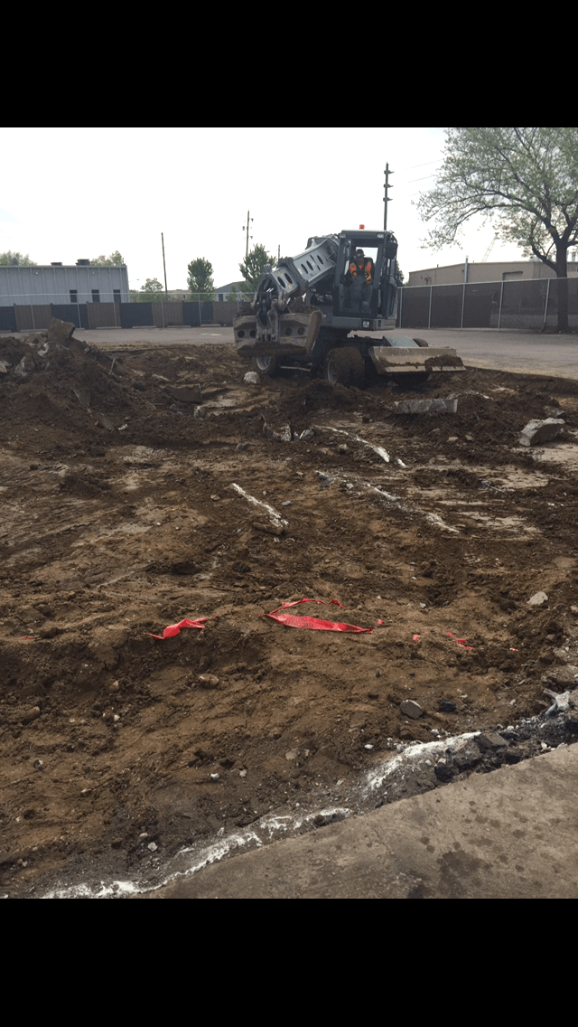 A bulldozer is moving dirt on a construction site.