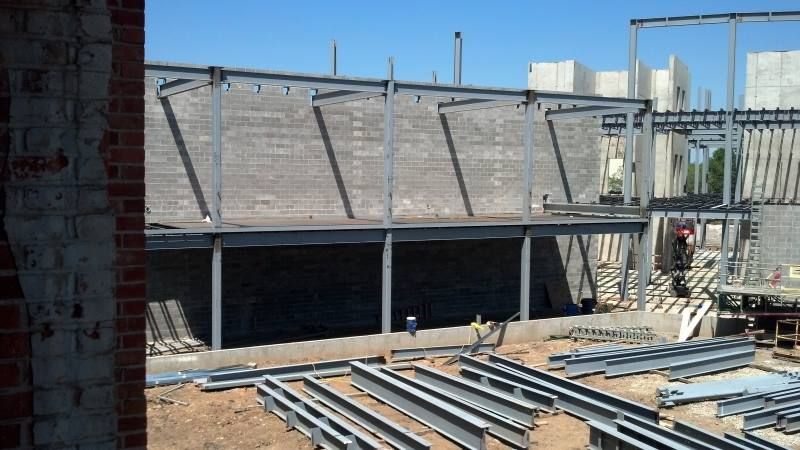 A building under construction with a lot of steel beams