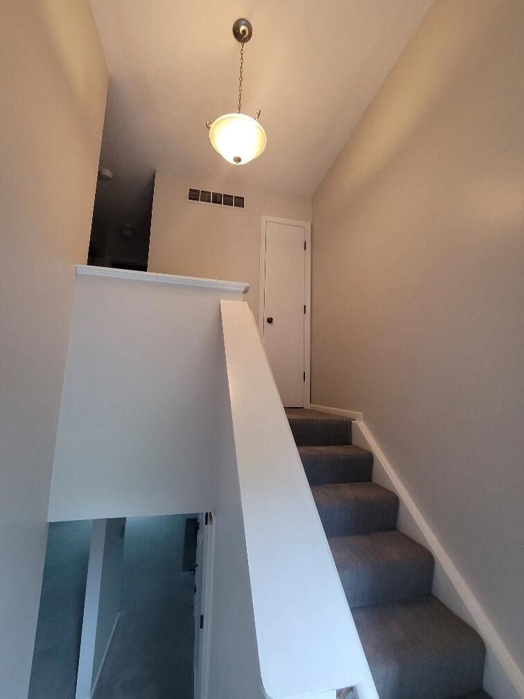 A staircase leading up to the second floor of a house