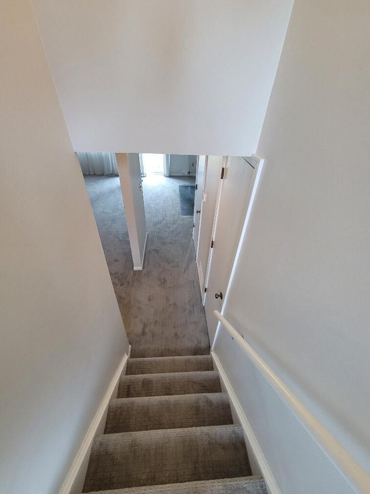A set of stairs leading up to the second floor of a house.