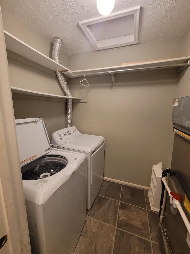 A laundry room with a washer and dryer in it.