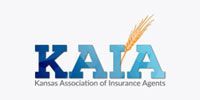 Logo of the Kansas Association of Insurance Agents (KAIA): Blue text with wheat image on white background.