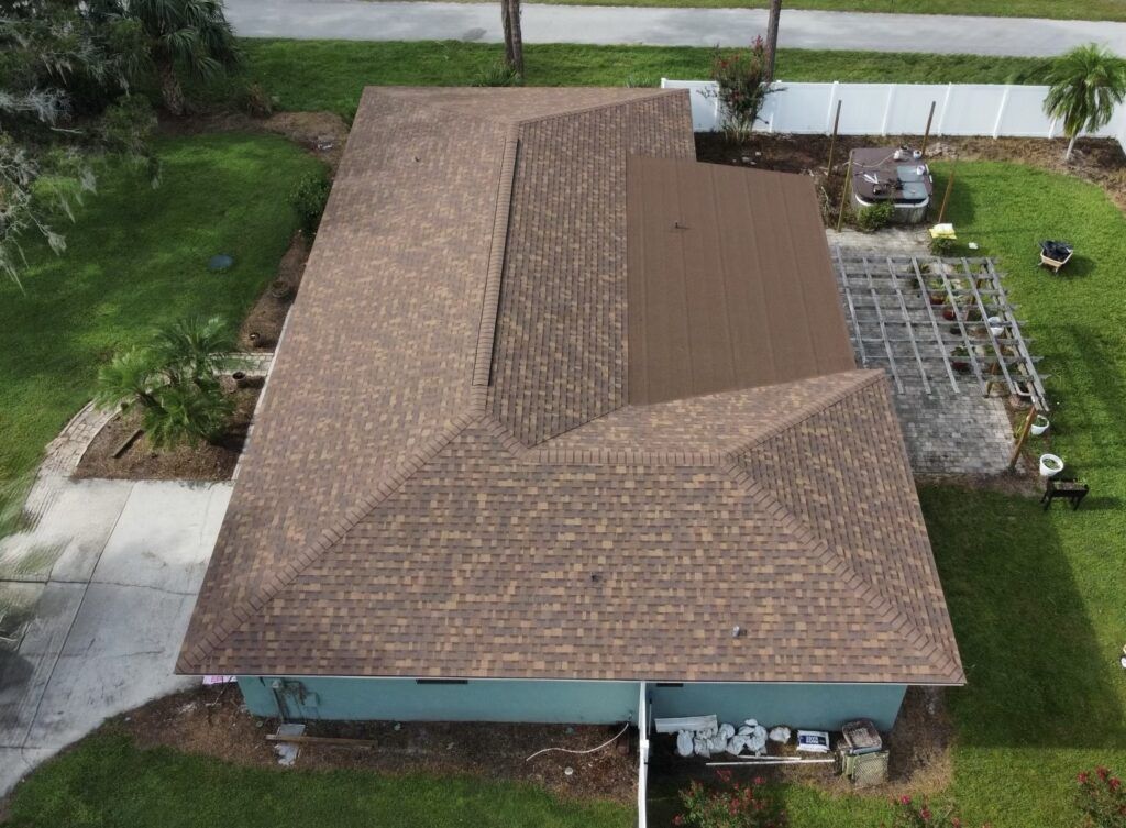 An aerial view of a house with a brown roof.