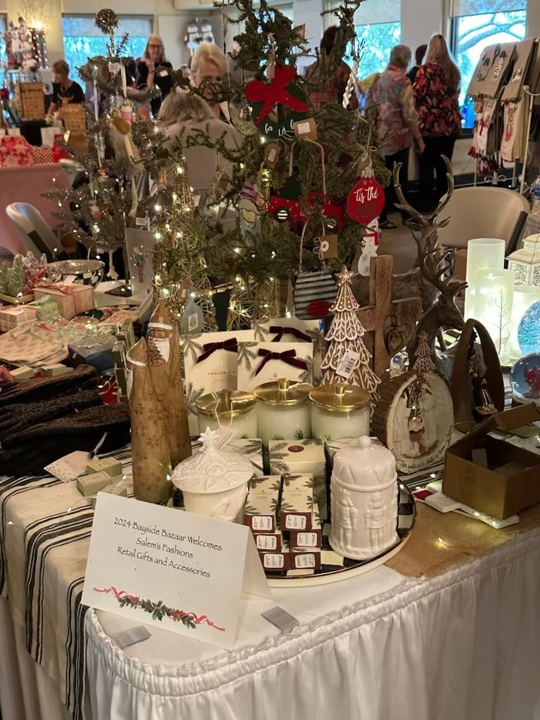 A table filled with lots of christmas decorations and candles.