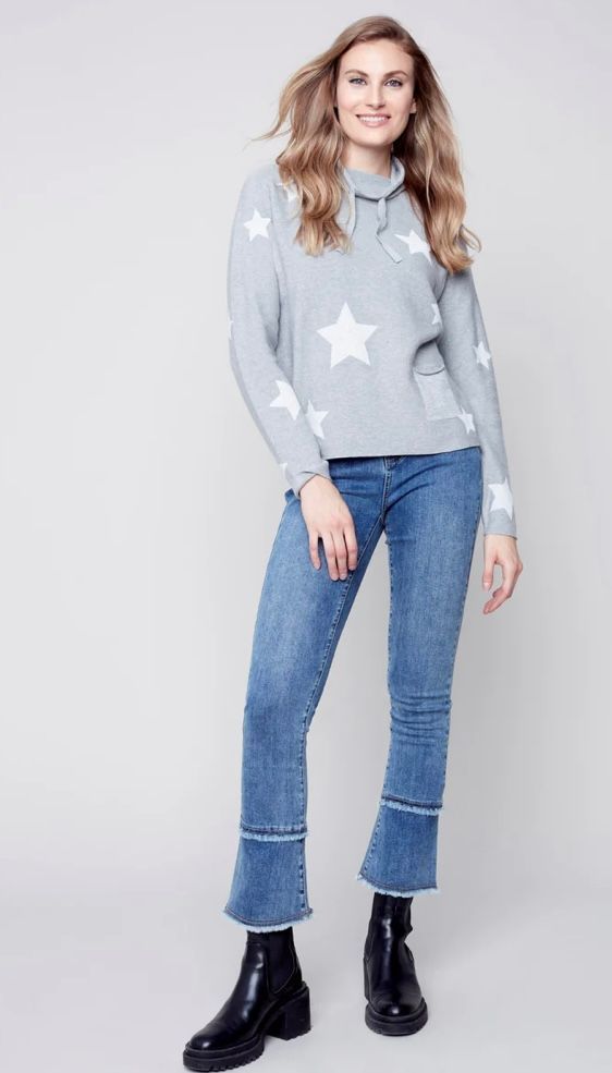 Woman in a gray sweater and jeans