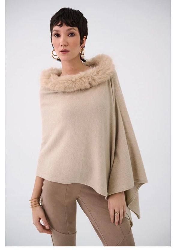 Woman in a beige poncho