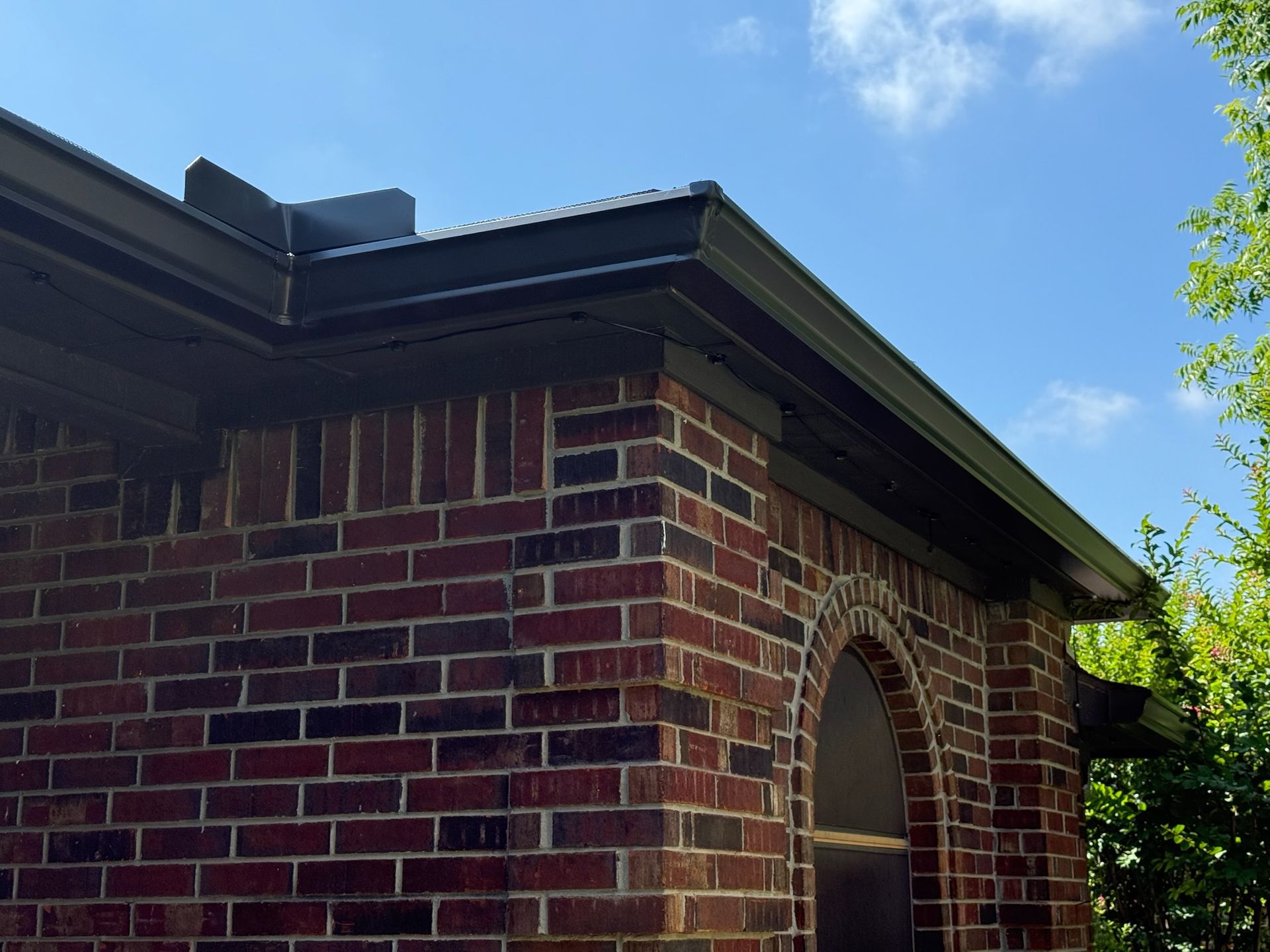A brick building with a blue sky in the background