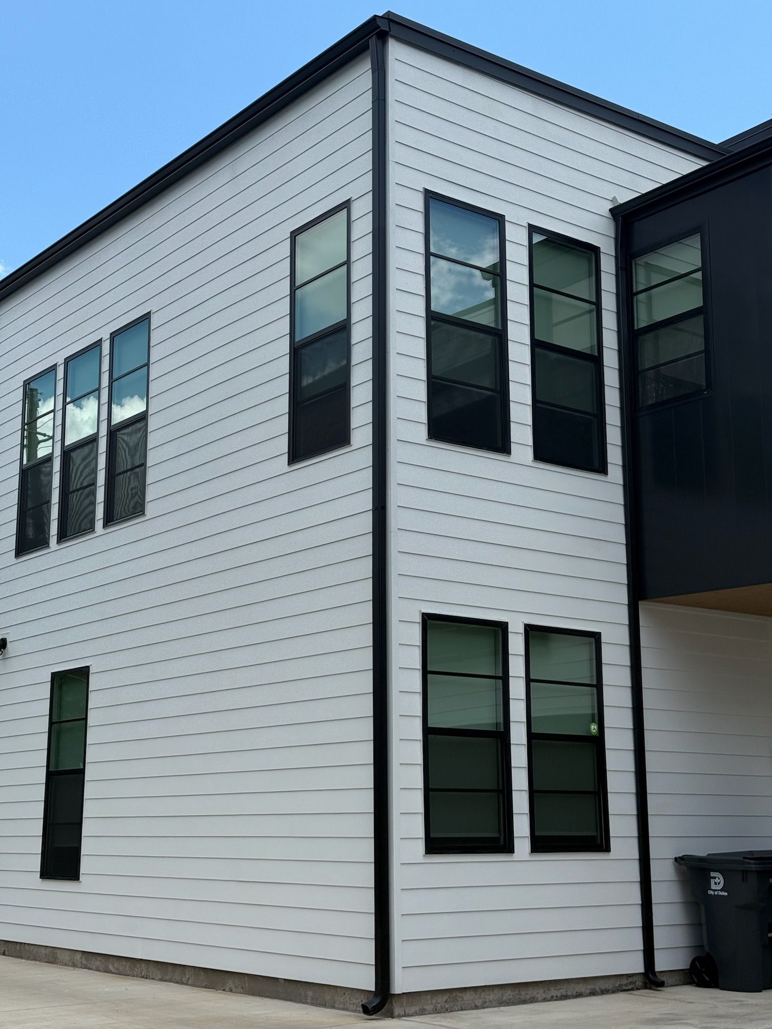 A white and black building with a lot of windows