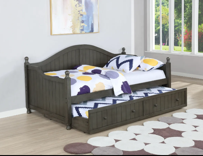 A day bed with drawers underneath it in a bedroom